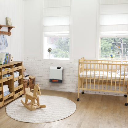 heat storm 1000 watt infrared heater displayed in a baby room, mounted on the wall